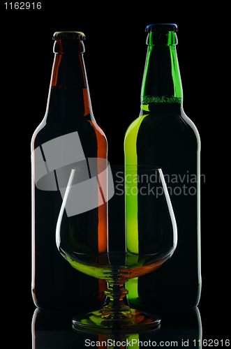 Image of Bottles of beer, isolated on a black background