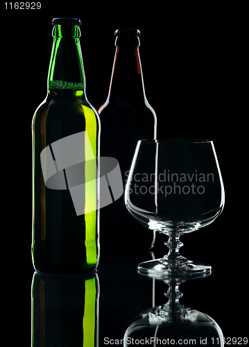 Image of Bottles of beer, isolated on a black background