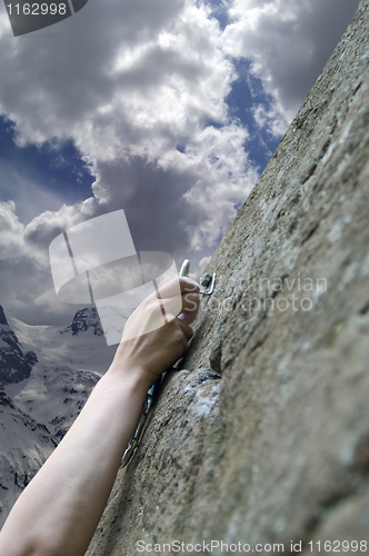 Image of Climber's hand with quick-draws