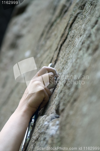 Image of Climbers hand and quick-draws