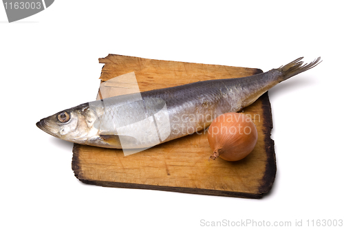 Image of Herring with onion on old wooden board