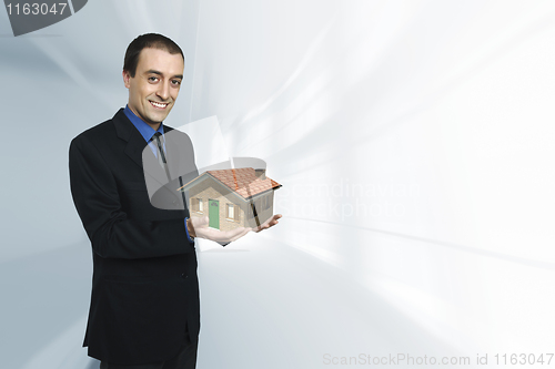 Image of businessman and house
