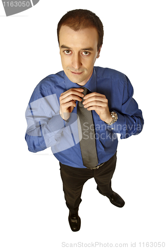 Image of businessman adjust tie