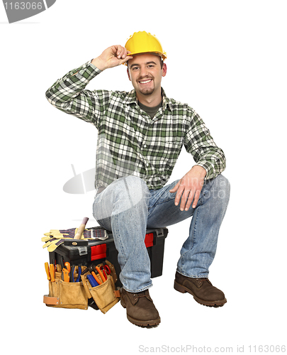 Image of happy worker on toolbox