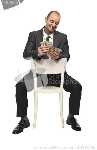 Image of sit businessman and money