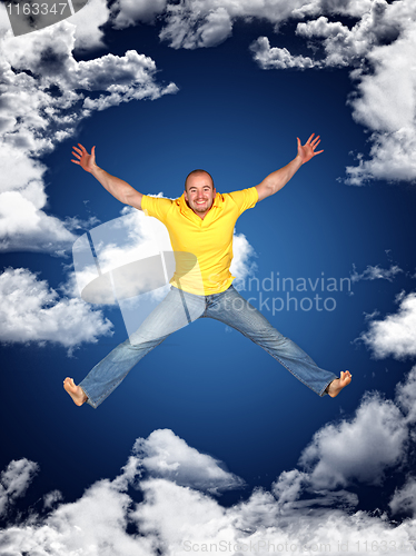 Image of young man jump and sky