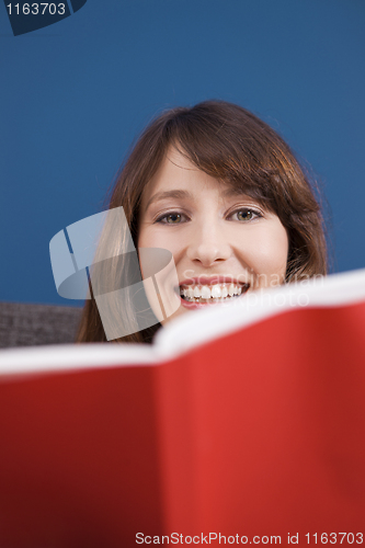 Image of Young girl reading a book