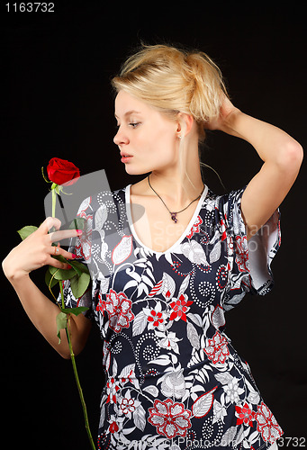 Image of Blonde with rose.