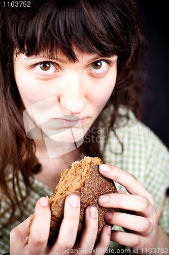 Image of beggar with a piece of bread 