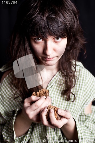 Image of  beggar with a piece of bread