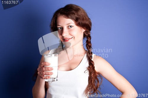 Image of  woman enjoying a glass of milk 