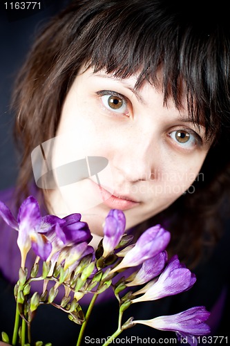 Image of woman with purple flowers