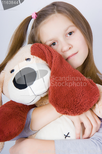 Image of Girl with toy dog