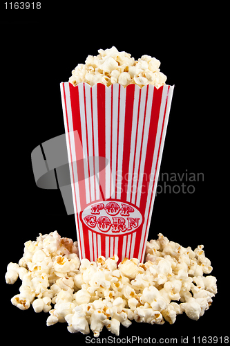 Image of Popcorn in bag with popcorn around