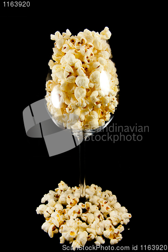 Image of Wine glass with popcorn 