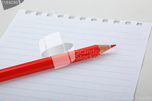 Image of The note and red pencil