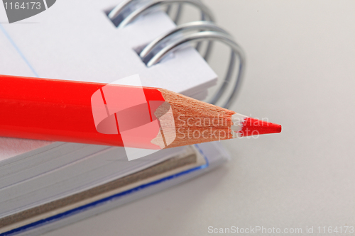 Image of The notepad and red pencil