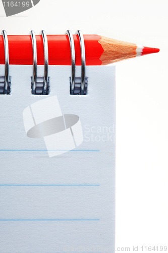 Image of The notepad and red pencil