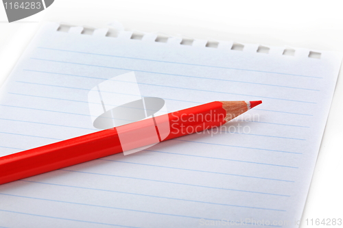 Image of The notepad and red pencil