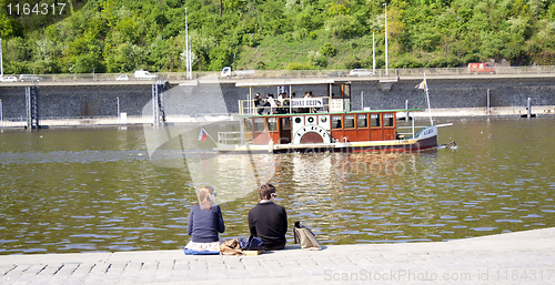 Image of people sitting on the creek. rest.