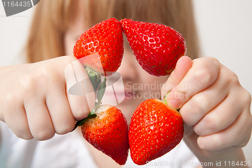 Image of Little girl with strawberries