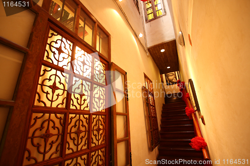 Image of Chinese traditional corridor in wooden with red lantern.