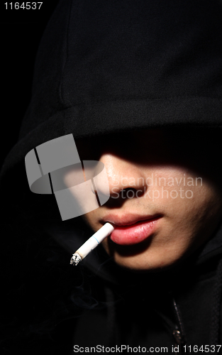 Image of Monochrome picture of a guy in a hood 