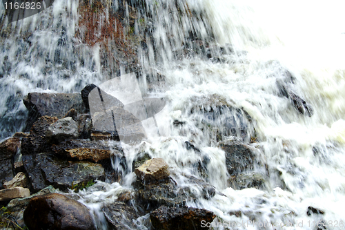 Image of Scenic waterfall  cascading over rocks
