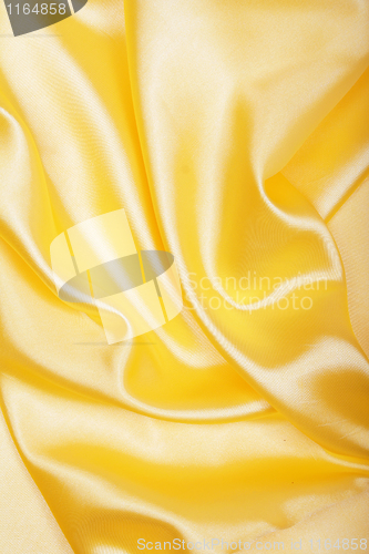 Image of Smooth elegant golden silk as background 