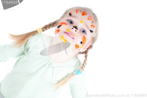 Image of Little girl playing with colors