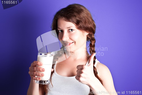 Image of woman enjoying a glass of milk
