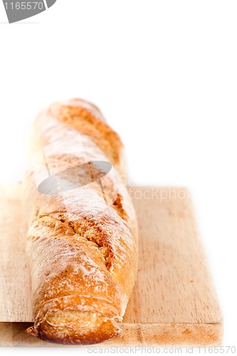 Image of baguette on the wooden board 