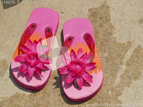 Image of flip flop sandals by the pool