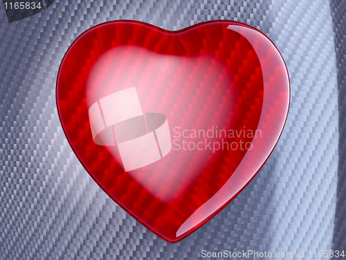 Image of Red heart shape over carbon fibre