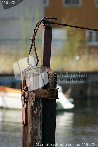 Image of Rusty Pole in Water