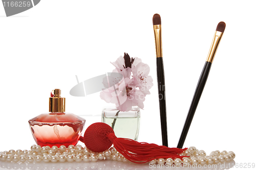 Image of Pearls beads, perfume, two cosmetics brush