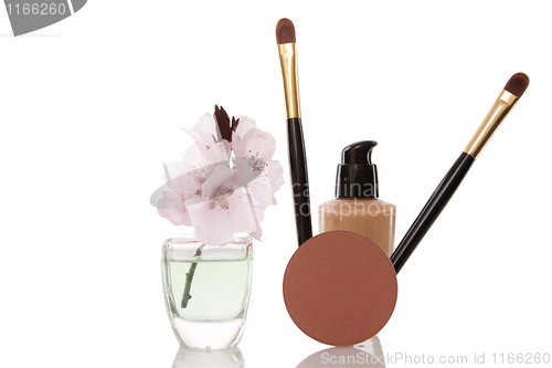 Image of cosmetics and cherry flower