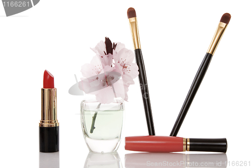 Image of cosmetics and cherry flower