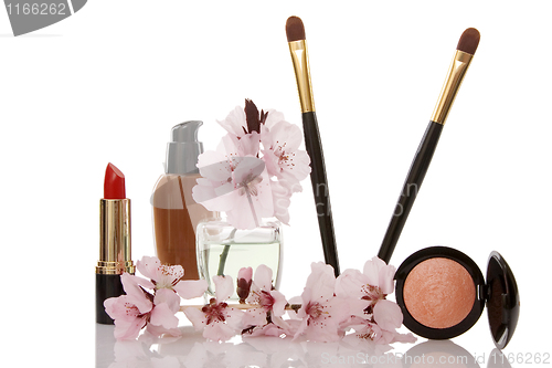 Image of cosmetics and cherry flower