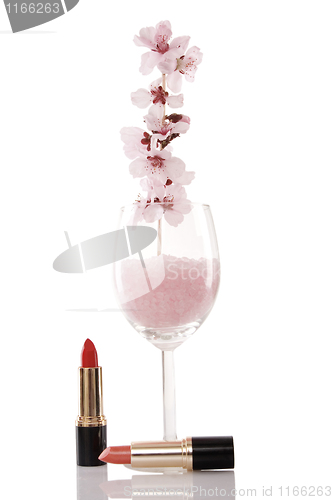 Image of red lipsticks and cherry flower