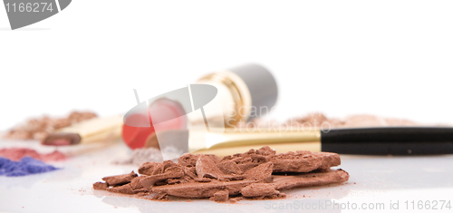 Image of Make-up brush, lipstick and different powder