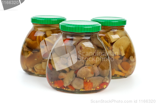Image of Glass jars with marinated mushrooms