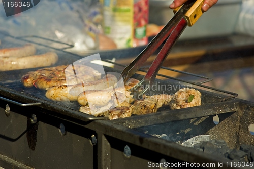 Image of Sausages and meat on the grill