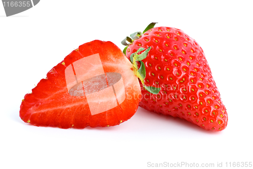 Image of Ripe red strawberry. Whole and half