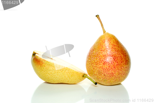 Image of Whole yellow-red pear and half