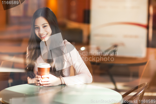 Image of Woman drinking coffee