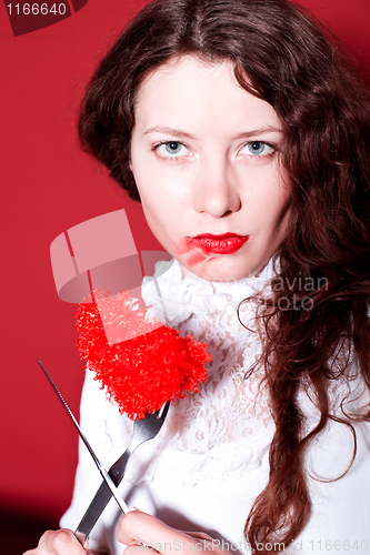 Image of woman with red heart on a fork