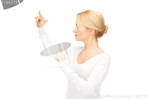 Image of businesswoman working with something imaginary