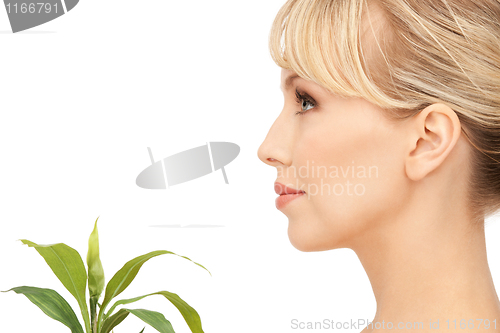 Image of woman with green sprout