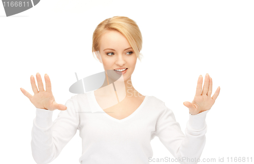 Image of businesswoman working with something imaginary